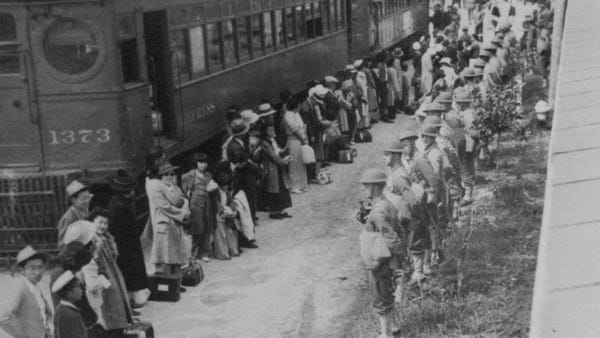Japanese citizens gather at a train which will tak