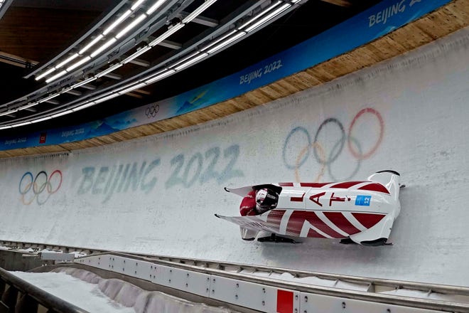 Latvians Oskars Kibermanis and Matiss Miknis compete in the two-man bobsleigh during the Beijing 2022 Olympic Winter Games at Yanqing Sliding Centre in Yanqing, China, on Monday, Feb. 14, 2022.