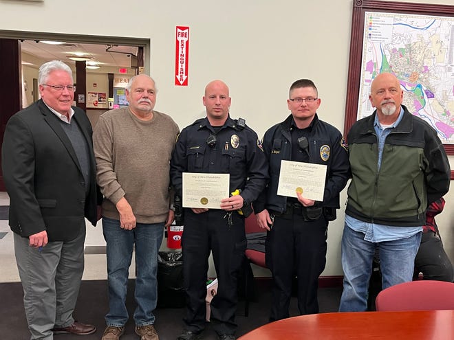Two New Philadelphia police officers were honored Monday for their service to the city. Pictured are Mayor Joel Day (Left), Safety Director Greg Popham, Officer Mark Sadolsky, Officer Andrew Boyd and Police Chief Michael Goodwin.