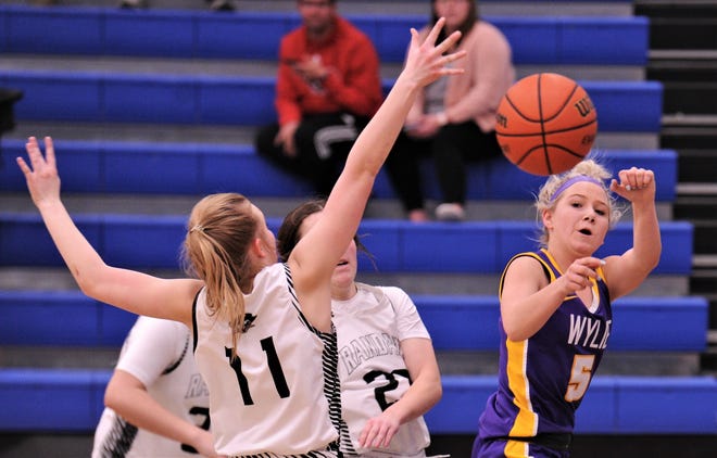 Wylie's Camri Travis (5) passes the ball as Canyon Randall's Ashley Norman (11) defends in the second half.
