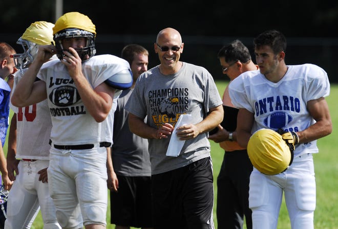 South All-Star coach Ryan Teglovic of Colonel Crawford shares a laugh with with his players during practice.
