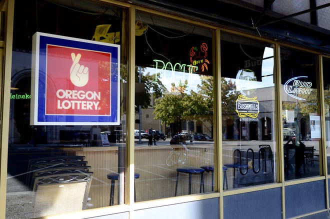 A Oregon Lottery sign hangs in the window of The Brick Bar & Broiler in downtown Salem on Thursday, Oct. 9, 2014.