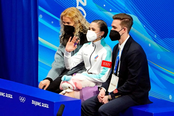 Russian coach Eteri Tutberidze and figure skater Kamila Valieva after she placed first in the short program on  Feb. 15, 2022, at the Beijing Olympics.