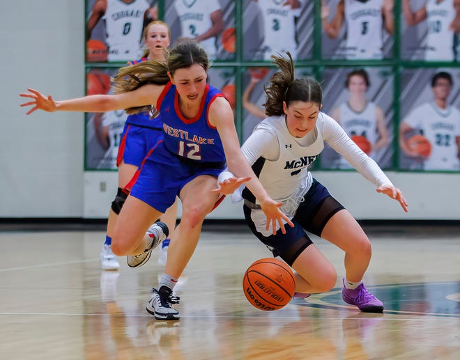Westlake forward Bella Hesse, left, and McNeil forward Riley Samples chase the loose ball during the fourth period of the Class 6A bi-district girls basketball playoff game Tuesday at Connally High School. McNeil pulled away for a 38-30 win in its first playoff game since 2008.