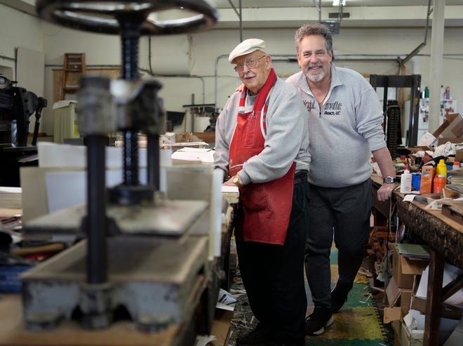 From left: Father and son Ron and Skip Bowman own and operate Beck & Orr Book Binding, which has been in business since 1888. The old-fashioned business on the Hilltop specializes in the repair and restoration of books, along with binding, foil stamping and embossing.