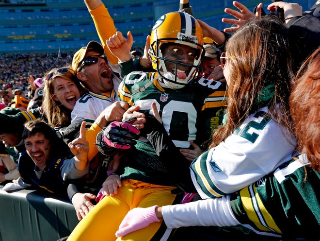 Packers wide receiver Donald Driver celebrates a touchdown after doing a Lambeau Leap during the second half against the Jacksonville Jaguars, Sunday, Oct. 28, 2012, in Green Bay. (AP Photo/Mike Roemer)