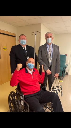 Dick Vitale and two members of Massachusetts General Hospital security on Tuesday after the 82-year-old ESPN college basketball analyst and Lakewood Ranch resident underwent vocal cord surgery.