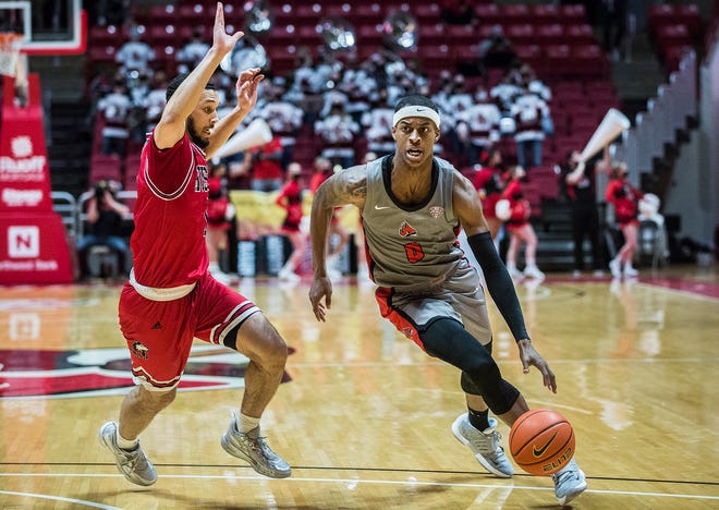 Ball State's Miryne Thomas dribbles past a Northern Illinois defender during a game against Northern Illinois played last February. Thomas has transferred to Kent State.