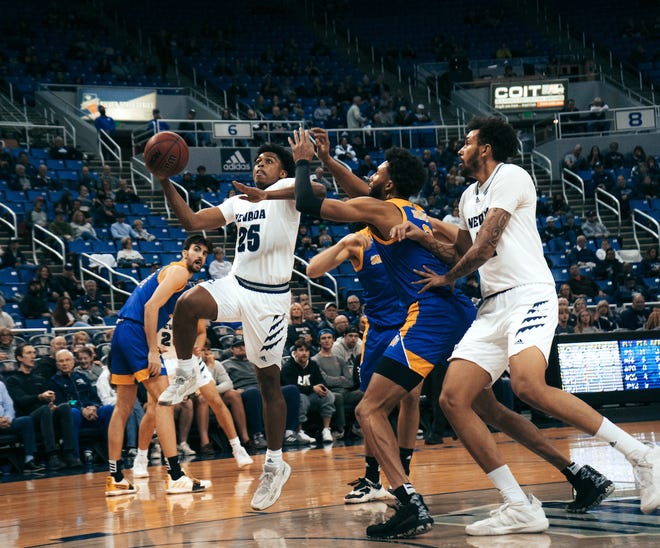 Nevada's Grant Sherfield drives to the basket on Tuesday night against San Jose State.