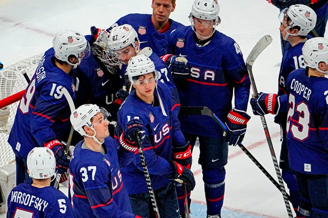Team USA reacts after losing to Slovakia in a shootout in the quarterfinals of the men's Olympic ice hockey tournament.