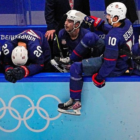 U.S. players react after losing to Slovakia in a s