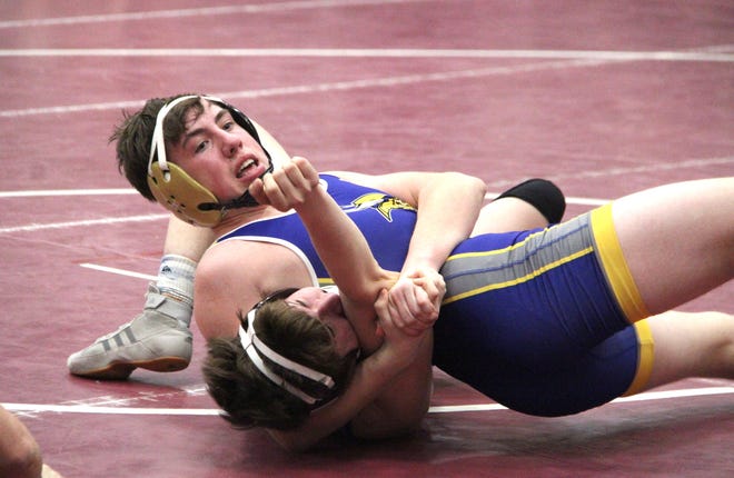 Bronson's Collin York works a deep head lock on Union City's Tyler Stevens on the way to a pin fall Wednesday night