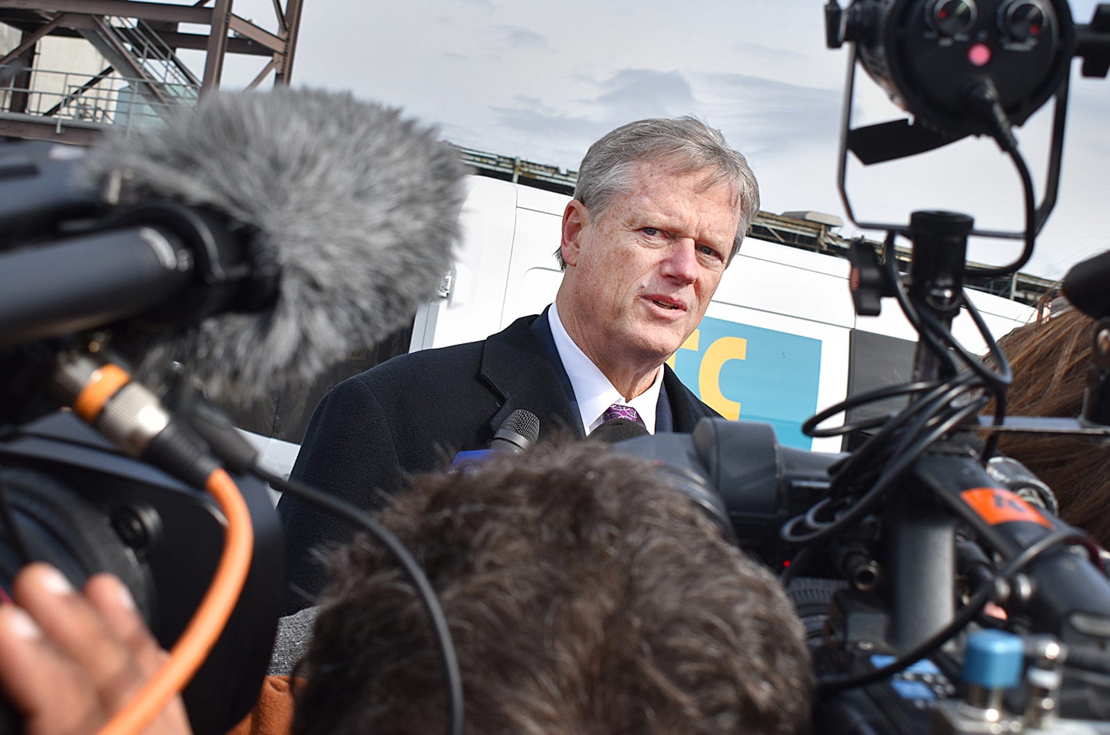 Govenor Charlie Baker speaks to media at the Brayton Point offshore wind announcement Thursday.
