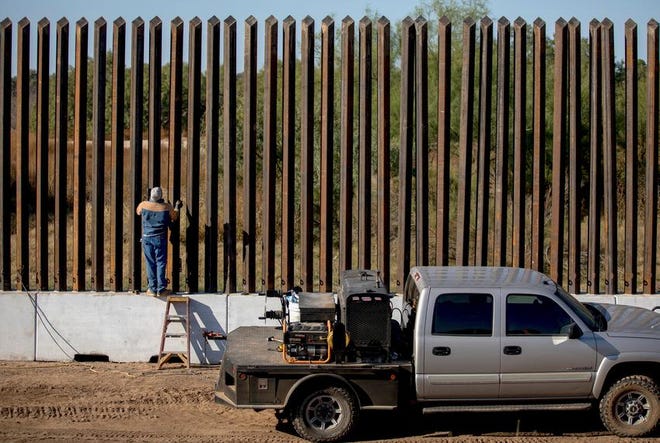 A welder worked last November on a new section of border wall near Eagle Pass.