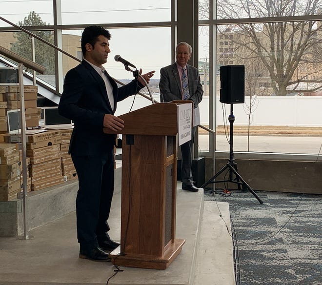 Nabi Mohammadi speaks at a news conference Thursday about Des Moines Area Community College's donation of laptops to Afghan refugees resettling in the Des Moines area. DMACC President Rob Denson made the announcement.
