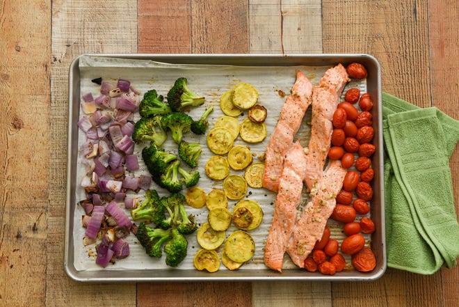 Sheet pan salmon dinner with vegetables.