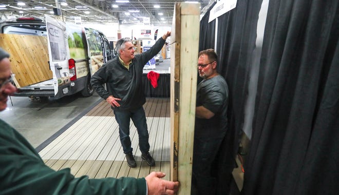 Mark Vetter, from left, Ted Grund and Ryan Helwig of UFP Retail Solutions prepare for the 60th NARI Home Improvement Show that takes place this weekend at the Wisconsin Exposition Center at State Fair Park, 8200 W. Greenfield Ave., in West Allis.