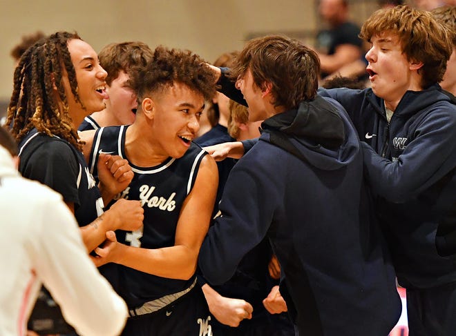 West York celebrates a 60-57 win over Northeastern during YAIAA boys' semifinal action at York County School of Technology in York Township, Wednesday, Feb. 16, 2022. Dawn J. Sagert photo