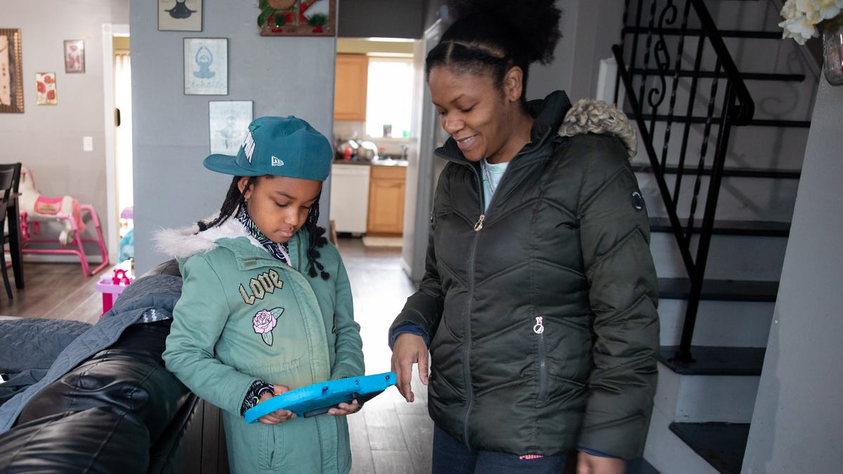 Raeanna Smith, 7, gets ready to go to the park with her mother Soledad Hyppolite, right, in Maybrook, NY, on Wednesday, February 16, 2022.