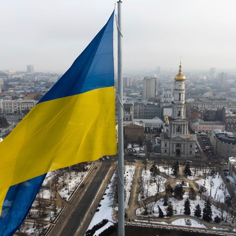A Ukrainian national flag waves over the center of