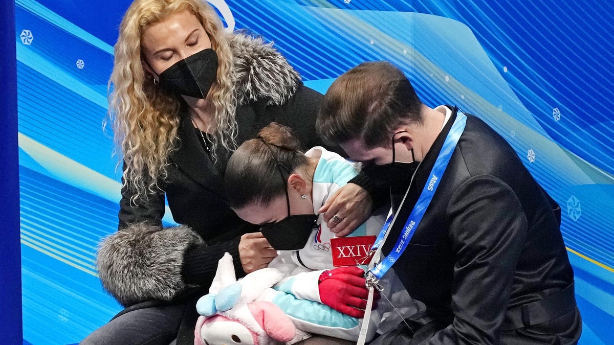 Kamila Valieva (ROC) reacts in the kiss and cry area in the women's figure skating free program during the Beijing 2022 Olympic Winter Games at Capital Indoor Stadium.