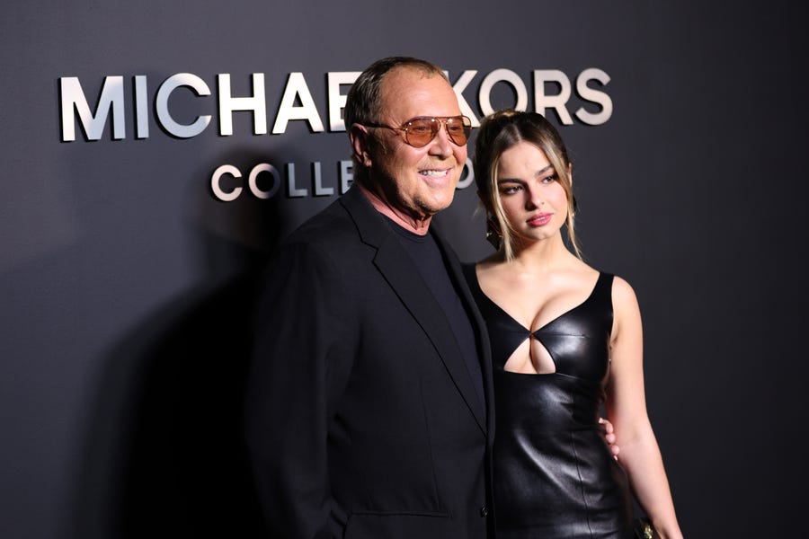 NEW YORK, NEW YORK - FEBRUARY 15:  Michael Kors and Addison Rae attend the Michael Kors Collection Fall/Winter 2022 Runway Show at Terminal 5 on February 15, 2022 in New York City. (Photo by Dimitrios Kambouris/Getty Images for Michael Kors) ORG XMIT: 775772799 ORIG FILE ID: 1370850084