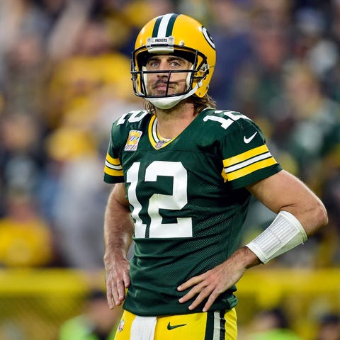 Aaron Rodgers #12 of the Green Bay Packers reacts 