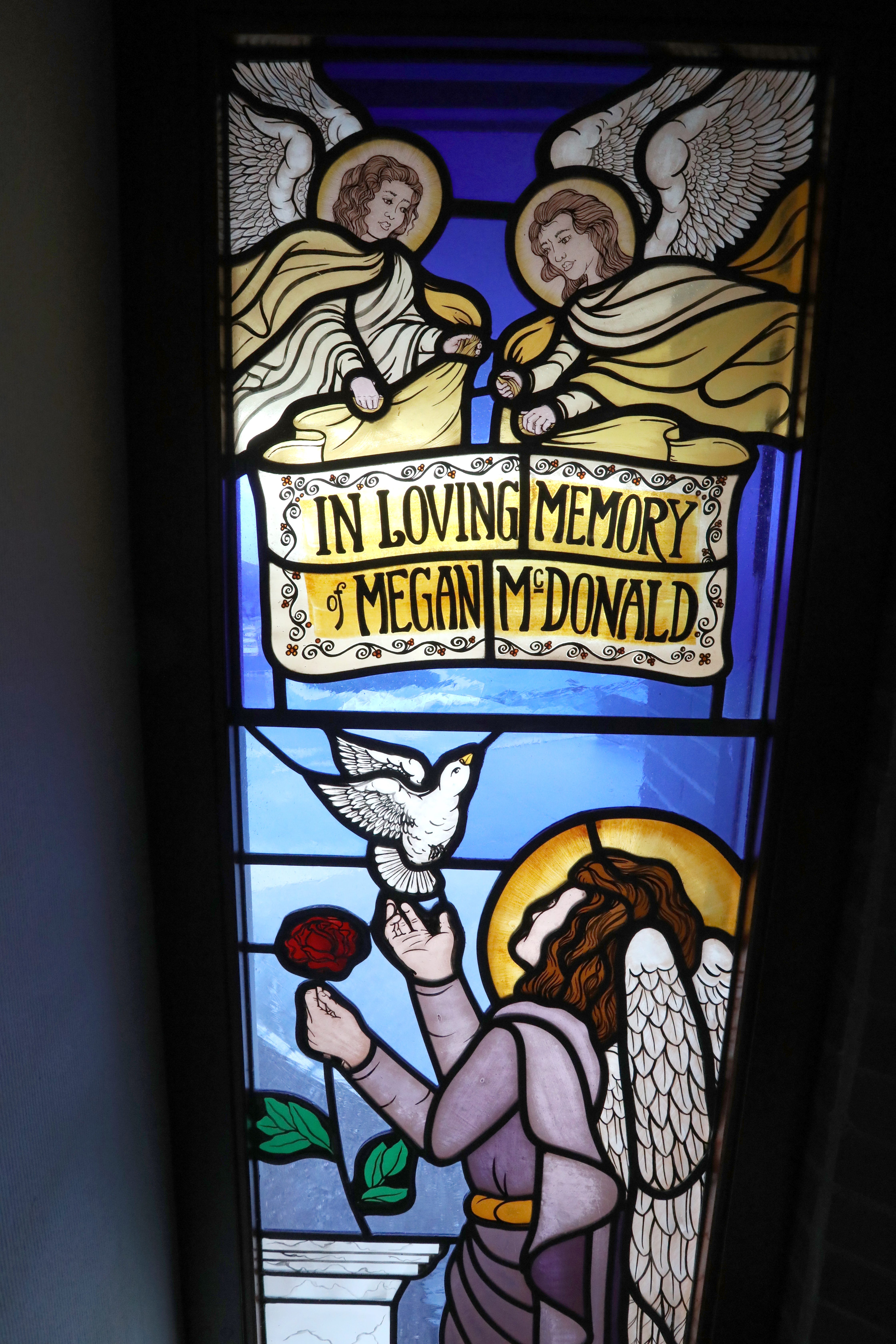 A stained glass window in memory of former student Megan McDonald at John S. Burke Catholic High School in Goshen Feb. 17, 2022.