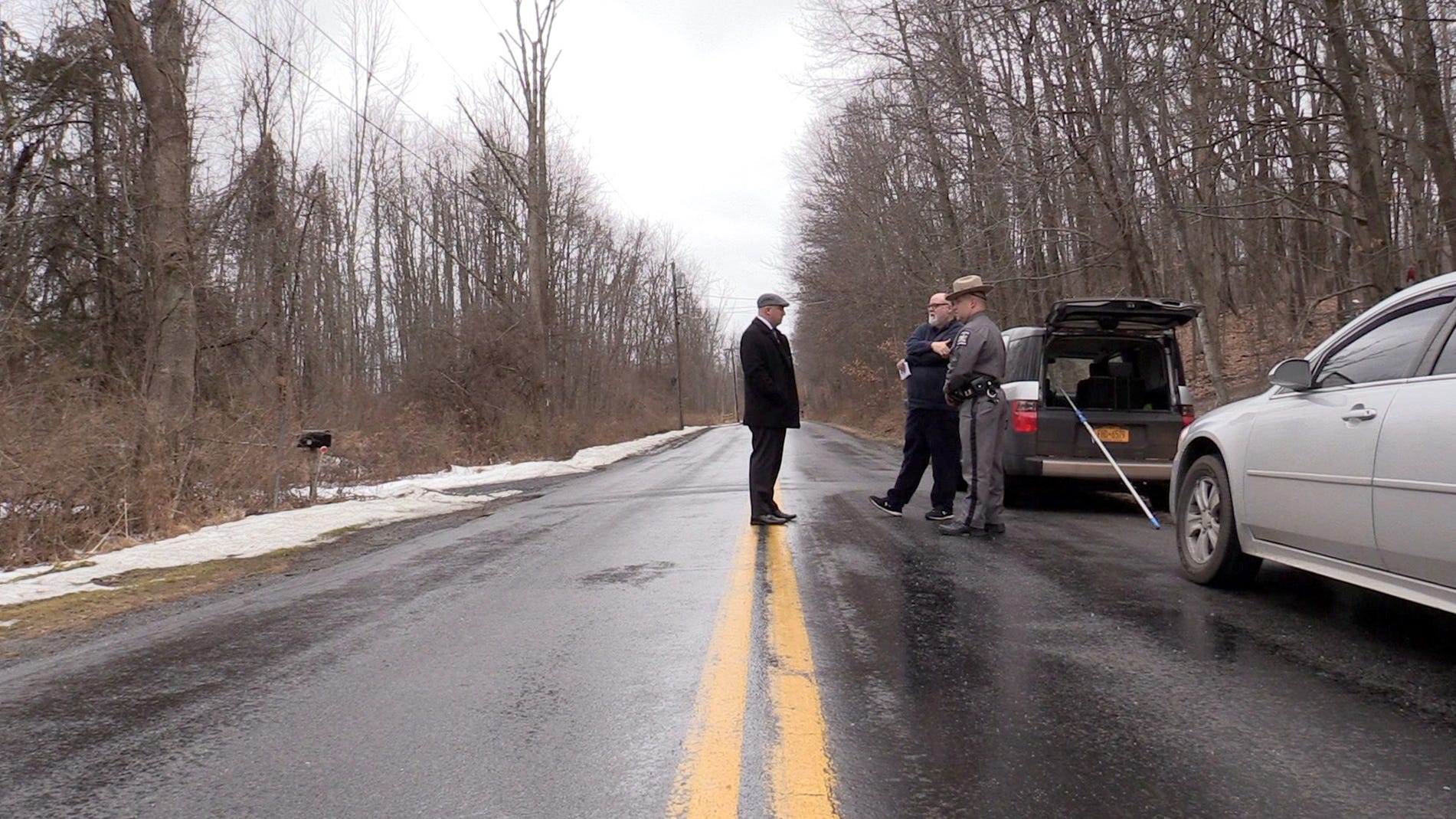 New York State Police Investigator Brad Natalizio, left, on Bowser Road in Wallkill, near where Megan McDonald's body was found Feb. 17, 2022.