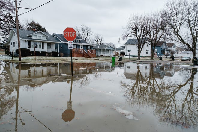 Flood waters on Twelfth Street are seen in Uhrichsville on Feb. 18.