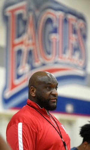 Veterans Memorial's head boys basketball coach Billy White Jr, center, leads a practice, Thursday, Feb. 17, 2022.