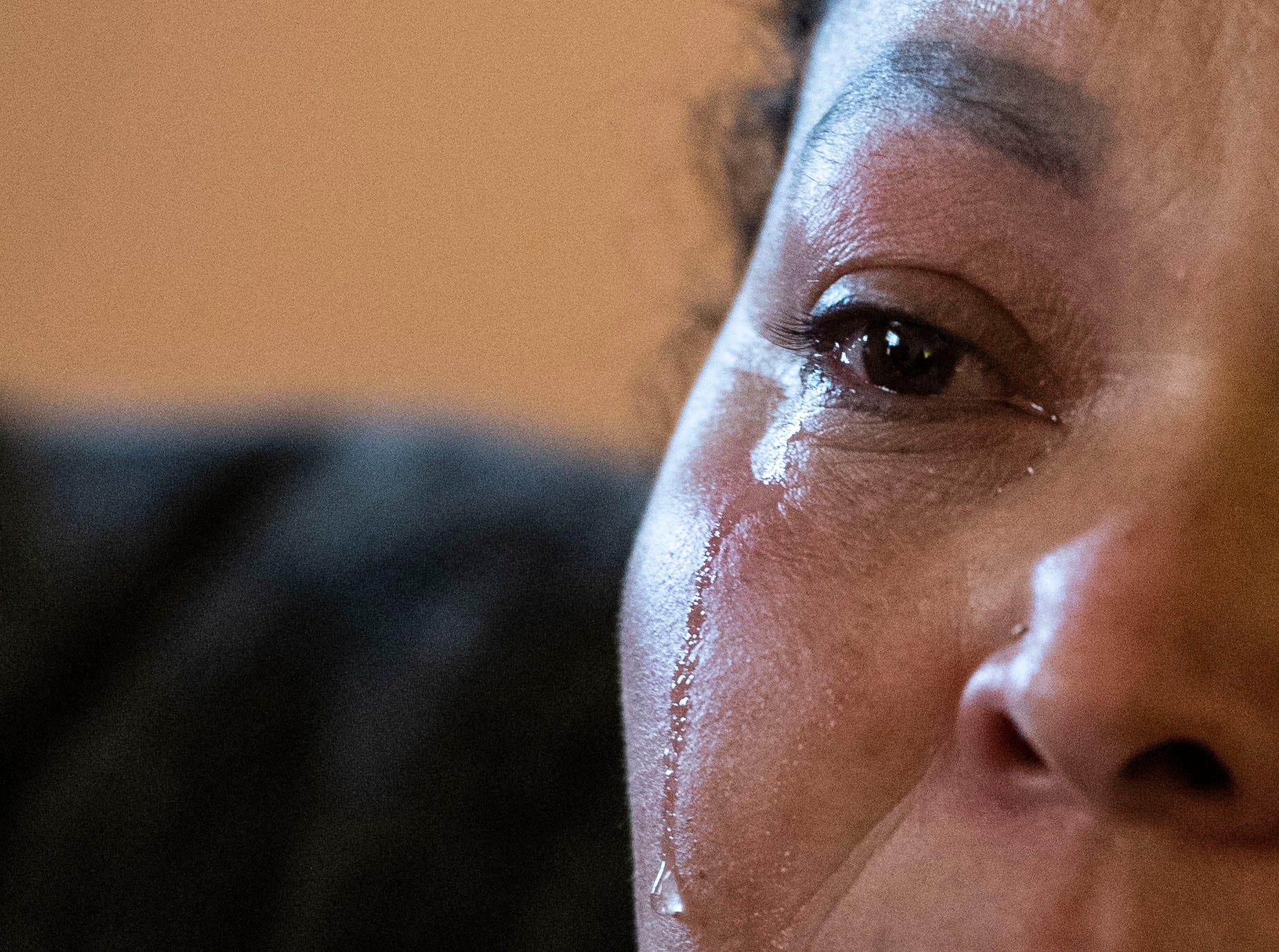Santa Castellon sheds a tear while talking about the shooting that happened outside of her apartment with one bullet hitting her six-year-old child, in Greenville, Friday, February 18, 2022.
