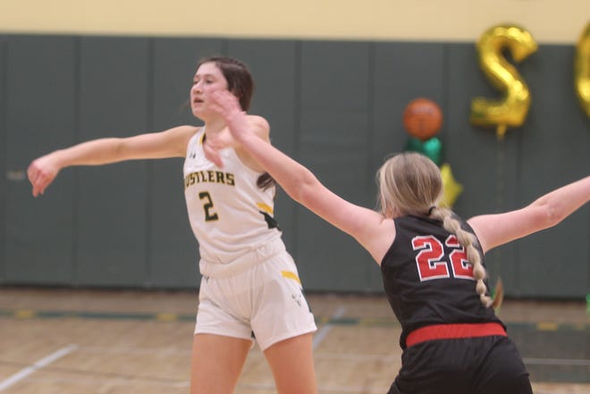 Senior Lauren Lindseth passes around the defense of Bozeman's Tailyn Black during an Eastern AA Conference game on Feb. 17 at the CMR Fieldhouse. CMR won the game 45-18.