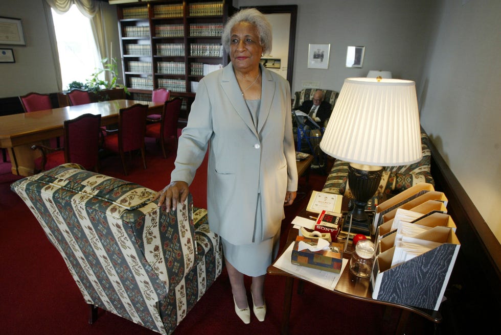 Judge Constance Baker Motley stands in her chambers in New York on May 7, 2004.