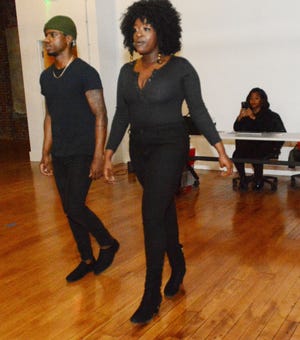 Models Regie Jones III and Noelani Colebut show their runway walk to Shella Jeanty, right, coordinator for Black History Month Vendor Fair and Fashion Show during a casting call at the Sunlight Building at Foundry 66. The event will begin at 1 p.m. in downtown Norwich on Feb. 26, with the fashion show starting at 5:45 p.m.