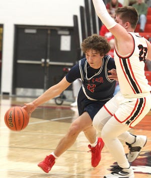 Bedford North Lawrence's Colten Leach (2) drives as New Albany's Tucker Biven (22) defends in the regular-season finale last season.