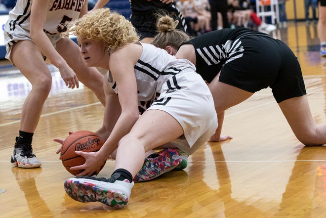 Fairfield Union’s Isabell Neal battles over possession of a loose the ball during a Division II district semifinal game on Feb. 19, 2022 at Southeastern High School in Chillicothe, Ohio. Fairfield Union defeated Waverly 66-58. 