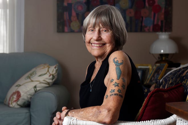 Gloria Weberg shows off a new tattoo on Feb. 3, 2022, at her home in St. Joseph, Mich., that the had added recently to celebrate her 100th birthday.