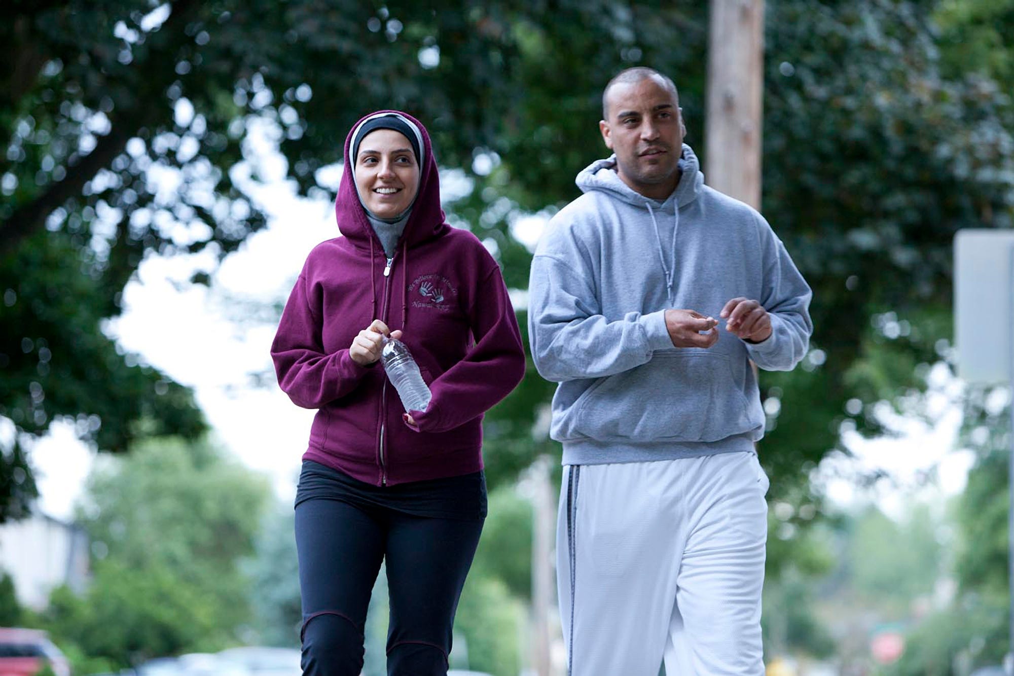 Nawal Aoude, a pediatric respiratory therapist, left, and her husband Nader go for a walk in a scene from the TLC series 