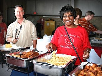 Smyrna Rotary Club member Caroline Peebles (right) and State Rep. Mike Sparks at the Wings of Freedom Fry event.