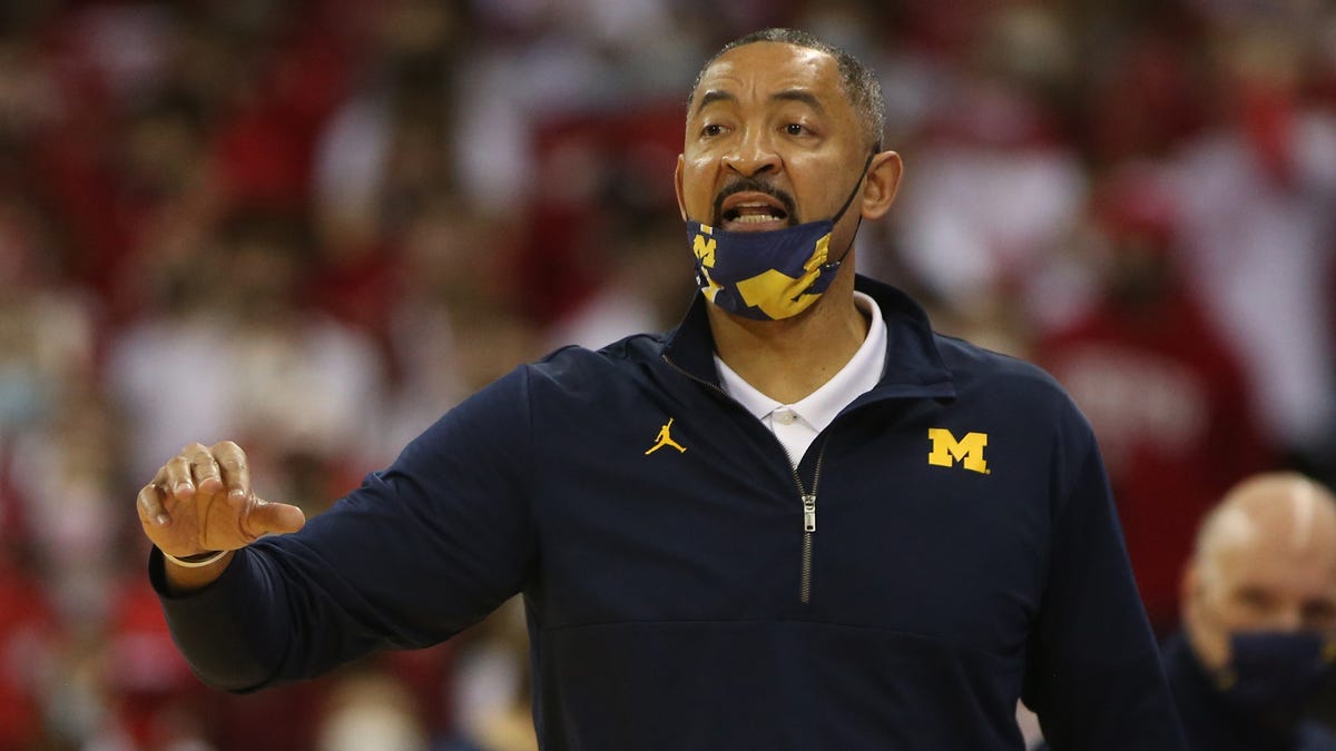 Michigan Wolverines head coach Juwan Howard  directs his team during the game against the Wisconsin Badgers at the Kohl Center.
