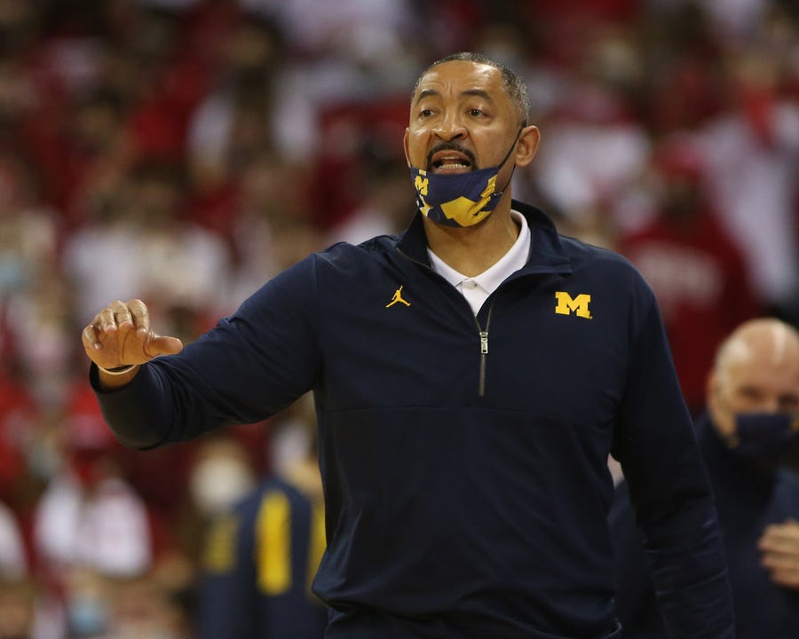 Michigan Wolverines head coach Juwan Howard  directs his team during the game against the Wisconsin Badgers at the Kohl Center.