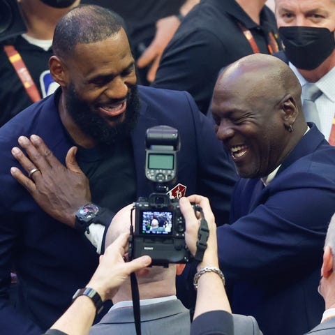 LeBron James and Michael Jordan share a laugh duri