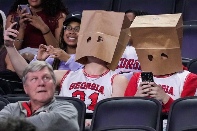 Georgia fans show their displeasure on Saturday against Mississippi at Stegeman Coliseum.