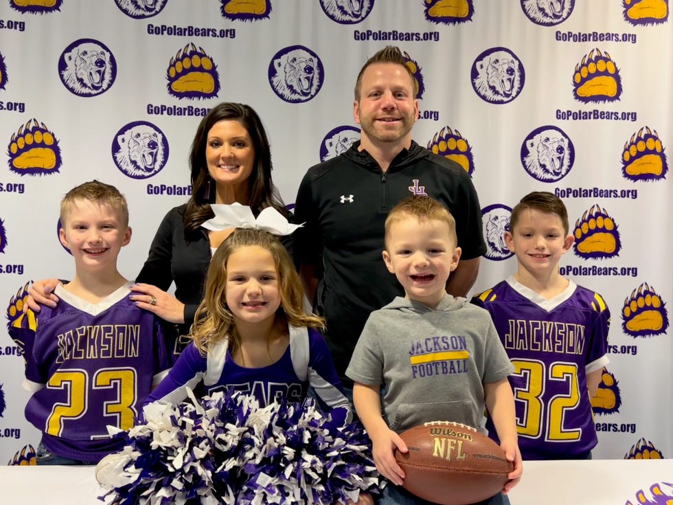 New Jackson High School head football coach Jay Rohr joins his wife, Mandy, for a picture with their twin sons, JJ and Jordy (9 years old); daughter, Avery (6); and son,
Jace (3).