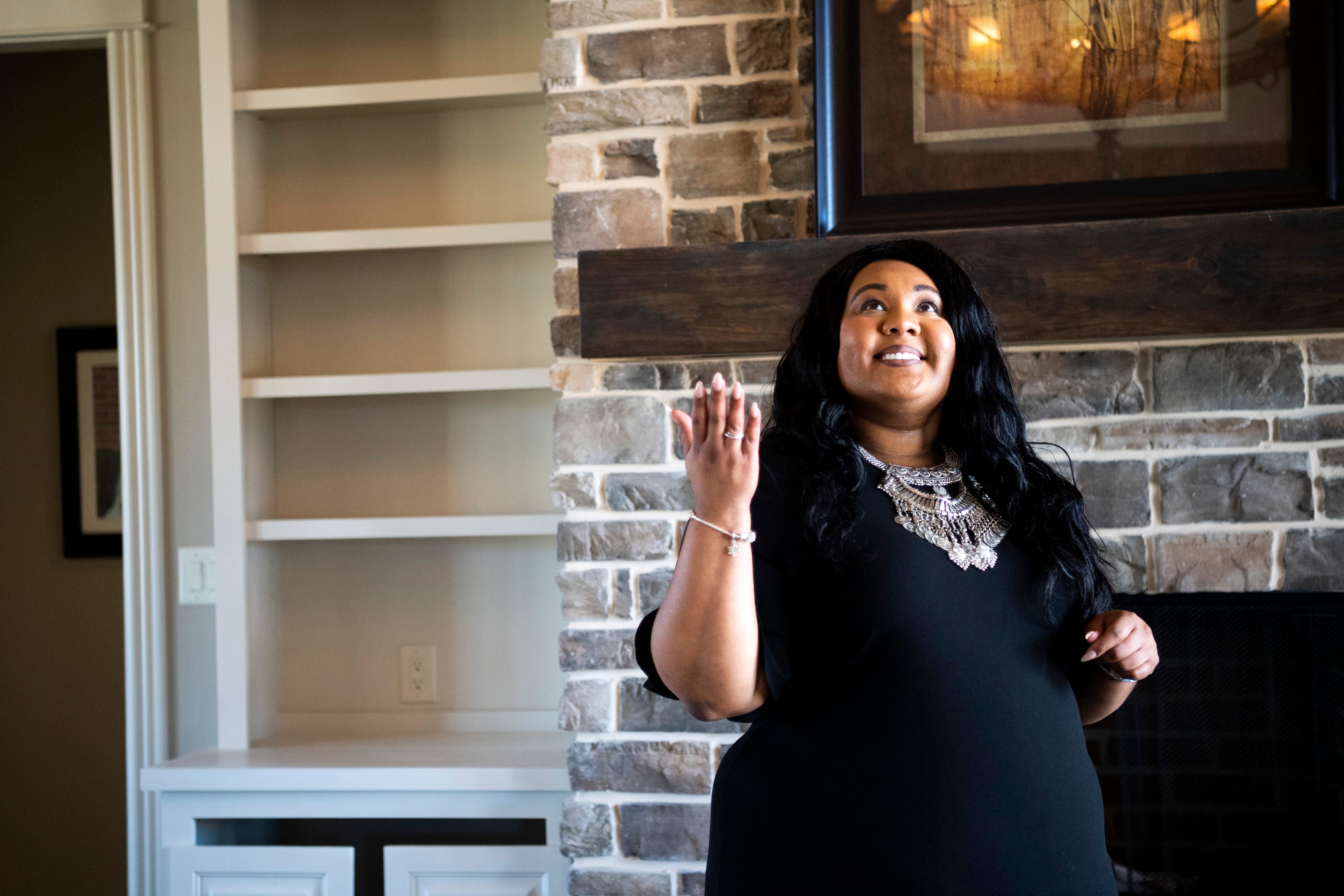 Adrienne Landes points out features in a newly built home in Lenoir City. Adrienne has had to overcome the challenges and stereotypes that come with being a young real estate agent. She said the late nights and weekends she works are worth it when she sees her clients happy in their new homes.