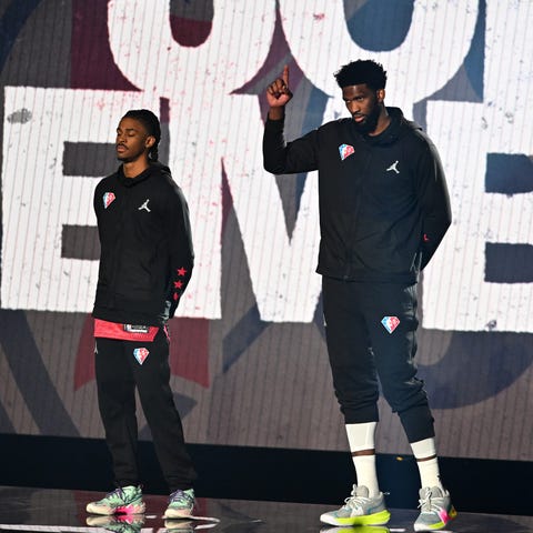 Joel Embiid of Team Durant waves to the crowd befo