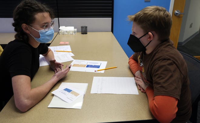 Sophie Turner works with Wyeth Cook-King, 10, during a tutoring session at Marburn Academy's new facility Feb. 22. The academy, based in New Albany, opened its second facility Feb. 17 at 1650 Watermark Drive in Columbus, near Grandview Heights.