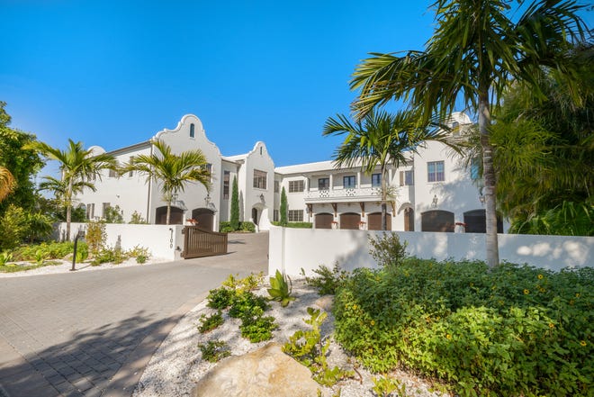 The 1.26-acre property at 100 Beach Ave. includes a 7,500-square-foot residence with five bedrooms, five full bathrooms and a half bath with direct gulf frontage of more than 110 feet of white sand beach. Marketing material for the property describes a custom built home with large windows maintaining water views throughout the property.