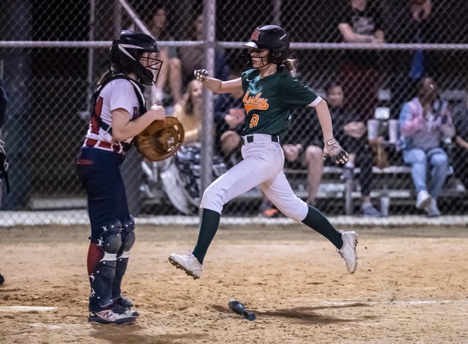 Mosley senior Emily Pitts gets airborne as she scores to tie the game.Mosley hosted Bozeman in softball Tuesday, February 22, 2022. The Dolphins came away with a 7-6 win over the Bucks.